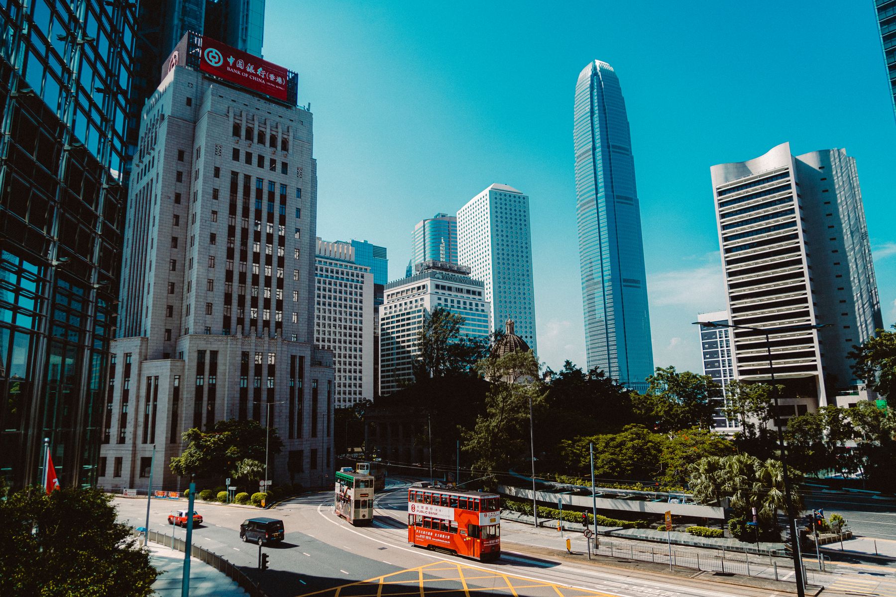 Hong Kong Central skyline with IFC and double-decker trams